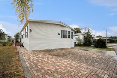 Welcome home to this beautifully maintained 3-bedroom, 2-bath on Polo Park East in Florida - for sale on GolfHomes.com, golf home, golf lot