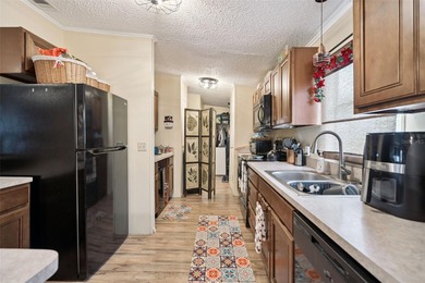 Welcome home to this beautifully maintained 3-bedroom, 2-bath on Polo Park East in Florida - for sale on GolfHomes.com, golf home, golf lot