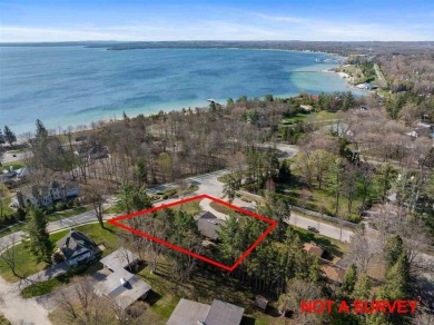 Mid-century modern classic, designed by renowned Charlevoix on Charlevoix Golf Club in Michigan - for sale on GolfHomes.com, golf home, golf lot
