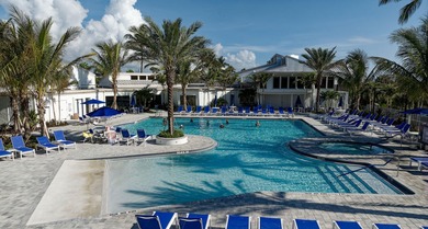 Beautiful first-floor corner unit in the resort-style community on Ocean Village Golf Course in Florida - for sale on GolfHomes.com, golf home, golf lot