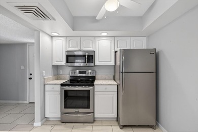 Beautiful first-floor corner unit in the resort-style community on Ocean Village Golf Course in Florida - for sale on GolfHomes.com, golf home, golf lot