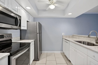 Beautiful first-floor corner unit in the resort-style community on Ocean Village Golf Course in Florida - for sale on GolfHomes.com, golf home, golf lot