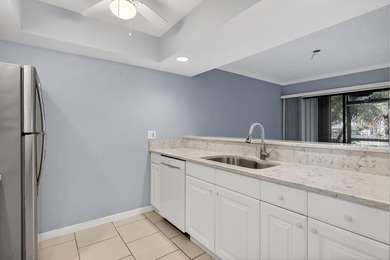 Beautiful first-floor corner unit in the resort-style community on Ocean Village Golf Course in Florida - for sale on GolfHomes.com, golf home, golf lot