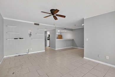 Beautiful first-floor corner unit in the resort-style community on Ocean Village Golf Course in Florida - for sale on GolfHomes.com, golf home, golf lot