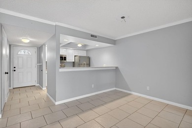 Beautiful first-floor corner unit in the resort-style community on Ocean Village Golf Course in Florida - for sale on GolfHomes.com, golf home, golf lot