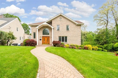 This elegant full-brick colonial sits on a prominent corner lot on Leewood Golf Club in New York - for sale on GolfHomes.com, golf home, golf lot
