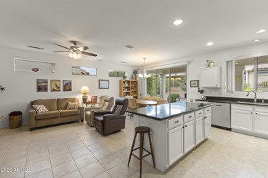 Welcoming one-owner home featuring a charming front courtyard on Sun City Grand Golf Couse and Club in Arizona - for sale on GolfHomes.com, golf home, golf lot