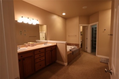Vaulted ceilings and inspired, open floorplan 4 bedroom 3 full on Eagle Bend Golf Course in Montana - for sale on GolfHomes.com, golf home, golf lot