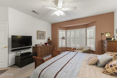 Welcoming one-owner home featuring a charming front courtyard on Sun City Grand Golf Couse and Club in Arizona - for sale on GolfHomes.com, golf home, golf lot