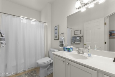 Welcoming one-owner home featuring a charming front courtyard on Sun City Grand Golf Couse and Club in Arizona - for sale on GolfHomes.com, golf home, golf lot