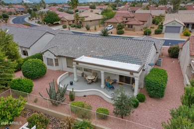 Welcoming one-owner home featuring a charming front courtyard on Sun City Grand Golf Couse and Club in Arizona - for sale on GolfHomes.com, golf home, golf lot