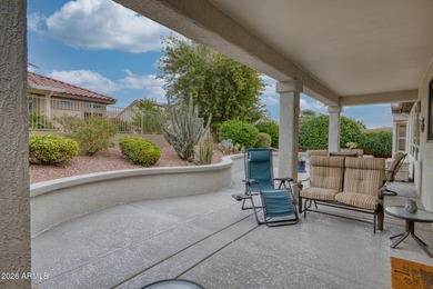 Welcoming one-owner home featuring a charming front courtyard on Sun City Grand Golf Couse and Club in Arizona - for sale on GolfHomes.com, golf home, golf lot