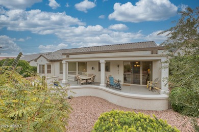 Welcoming one-owner home featuring a charming front courtyard on Sun City Grand Golf Couse and Club in Arizona - for sale on GolfHomes.com, golf home, golf lot