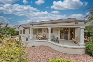Welcoming one-owner home featuring a charming front courtyard on Sun City Grand Golf Couse and Club in Arizona - for sale on GolfHomes.com, golf home, golf lot