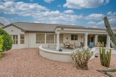 Welcoming one-owner home featuring a charming front courtyard on Sun City Grand Golf Couse and Club in Arizona - for sale on GolfHomes.com, golf home, golf lot
