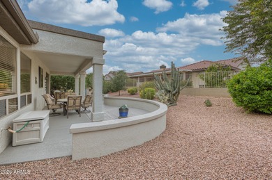 Welcoming one-owner home featuring a charming front courtyard on Sun City Grand Golf Couse and Club in Arizona - for sale on GolfHomes.com, golf home, golf lot