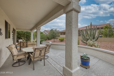 Welcoming one-owner home featuring a charming front courtyard on Sun City Grand Golf Couse and Club in Arizona - for sale on GolfHomes.com, golf home, golf lot