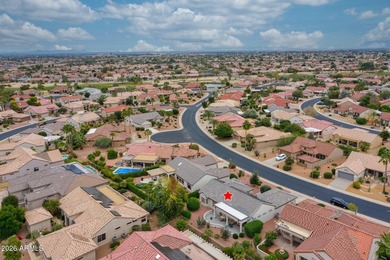 Welcoming one-owner home featuring a charming front courtyard on Sun City Grand Golf Couse and Club in Arizona - for sale on GolfHomes.com, golf home, golf lot