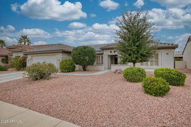 Welcoming one-owner home featuring a charming front courtyard on Sun City Grand Golf Couse and Club in Arizona - for sale on GolfHomes.com, golf home, golf lot