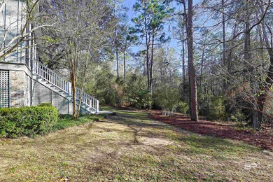 Quiet woods. Inviting porches. Thoughtful design. Set in the on Steelwood Country Club in Alabama - for sale on GolfHomes.com, golf home, golf lot