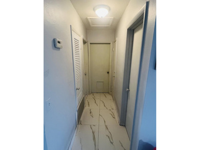 2/1 CBS NO HOA home in Port St. Lucie featuring a screened in on Club Med Sandpiper in Florida - for sale on GolfHomes.com, golf home, golf lot