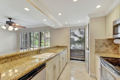 Rare first floor corner unit in Golf Villas, beautifully updated on PGA National Golf Club in Florida - for sale on GolfHomes.com, golf home, golf lot