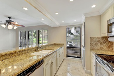 Rare first floor corner unit in Golf Villas, beautifully updated on PGA National Golf Club in Florida - for sale on GolfHomes.com, golf home, golf lot