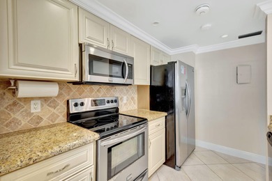 Rare first floor corner unit in Golf Villas, beautifully updated on PGA National Golf Club in Florida - for sale on GolfHomes.com, golf home, golf lot