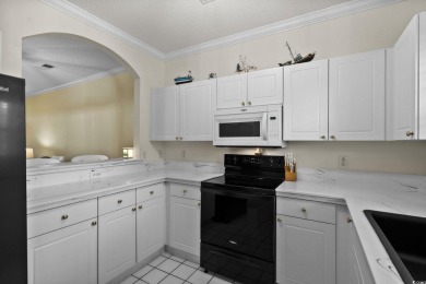 Welcome to this charming 2 bedroom, 2 bathroom 1st floor condo on Barefoot Resort and Golf Club  in South Carolina - for sale on GolfHomes.com, golf home, golf lot
