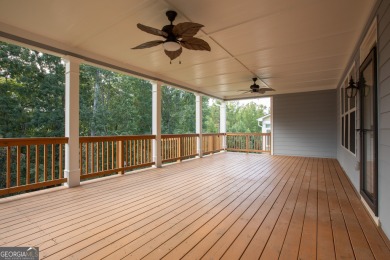 Tucked away on a wooded lot in Cresswind at Lake Lanier, a on Lanier Island Legacy Golf Couorse in Georgia - for sale on GolfHomes.com, golf home, golf lot
