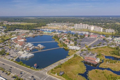 Welcome to this charming 2 bedroom, 2 bathroom 1st floor condo on Barefoot Resort and Golf Club  in South Carolina - for sale on GolfHomes.com, golf home, golf lot