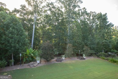 Tucked away on a wooded lot in Cresswind at Lake Lanier, a on Lanier Island Legacy Golf Couorse in Georgia - for sale on GolfHomes.com, golf home, golf lot