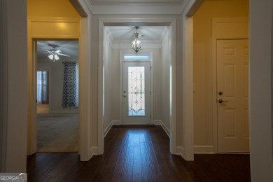 Tucked away on a wooded lot in Cresswind at Lake Lanier, a on Lanier Island Legacy Golf Couorse in Georgia - for sale on GolfHomes.com, golf home, golf lot