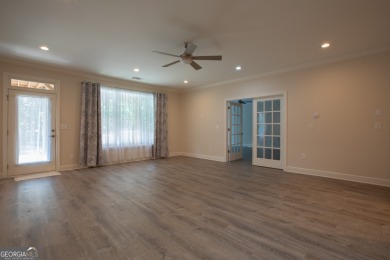 Tucked away on a wooded lot in Cresswind at Lake Lanier, a on Lanier Island Legacy Golf Couorse in Georgia - for sale on GolfHomes.com, golf home, golf lot