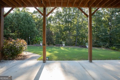 Tucked away on a wooded lot in Cresswind at Lake Lanier, a on Lanier Island Legacy Golf Couorse in Georgia - for sale on GolfHomes.com, golf home, golf lot