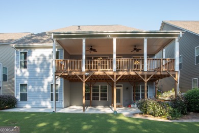 Tucked away on a wooded lot in Cresswind at Lake Lanier, a on Lanier Island Legacy Golf Couorse in Georgia - for sale on GolfHomes.com, golf home, golf lot
