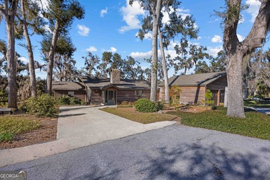 Discover this beautifully preserved mid-century lake house on Francis Lake Golf Club in Georgia - for sale on GolfHomes.com, golf home, golf lot