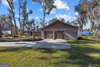 Discover this beautifully preserved mid-century lake house on Francis Lake Golf Club in Georgia - for sale on GolfHomes.com, golf home, golf lot