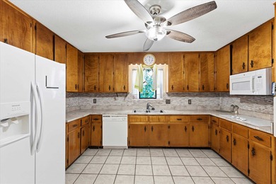 Endless potential and opportunity here! A spacious 4-bedroom, 2 on Jake Gaither Golf Course in Florida - for sale on GolfHomes.com, golf home, golf lot