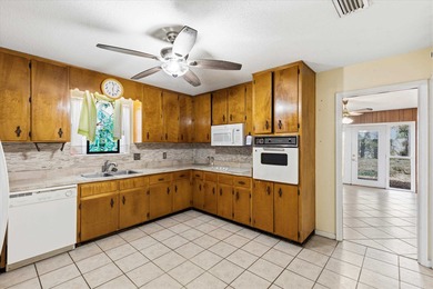 Endless potential and opportunity here! A spacious 4-bedroom, 2 on Jake Gaither Golf Course in Florida - for sale on GolfHomes.com, golf home, golf lot