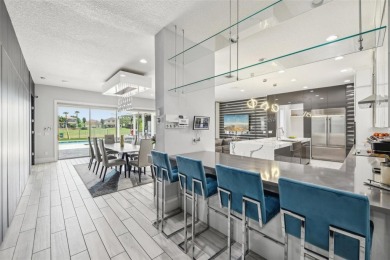 Welcome to 13136 Alderley Drive - a luxurious 5-bedroom, 5-bath on Eagle Creek Golf Club in Florida - for sale on GolfHomes.com, golf home, golf lot