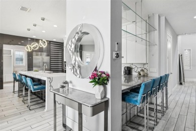 Welcome to 13136 Alderley Drive - a luxurious 5-bedroom, 5-bath on Eagle Creek Golf Club in Florida - for sale on GolfHomes.com, golf home, golf lot
