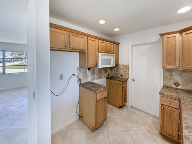 Welcome to 514 SW 20th Street in Palm Beach Leisureville on Leisureville Community Golf Course in Florida - for sale on GolfHomes.com, golf home, golf lot