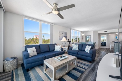 Stunning end unit offering water views galore!  This turnkey on Isla Del Sol Yacht and Country Club in Florida - for sale on GolfHomes.com, golf home, golf lot