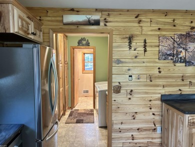 Charming 2 bedroom, 2 bath, 1,120 sq ft ranch home nestled on 3 on Garland Resort and Golf Club  in Michigan - for sale on GolfHomes.com, golf home, golf lot