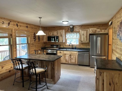Charming 2 bedroom, 2 bath, 1,120 sq ft ranch home nestled on 3 on Garland Resort and Golf Club  in Michigan - for sale on GolfHomes.com, golf home, golf lot