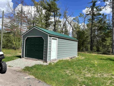 Charming 2 bedroom, 2 bath, 1,120 sq ft ranch home nestled on 3 on Garland Resort and Golf Club  in Michigan - for sale on GolfHomes.com, golf home, golf lot