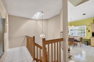 Lovely 2 bedroom, 2 bath residence with soaring vaulted ceilings on Indian Spring Golf and Country Club in Florida - for sale on GolfHomes.com, golf home, golf lot