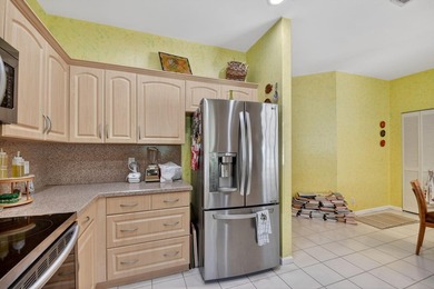 Lovely 2 bedroom, 2 bath residence with soaring vaulted ceilings on Indian Spring Golf and Country Club in Florida - for sale on GolfHomes.com, golf home, golf lot