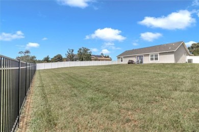 2021 CONCRETE BLOCK STUCCO BUILT HOME WITH 6 FOOT VINYL FENCED on Marion Oaks Country Club in Florida - for sale on GolfHomes.com, golf home, golf lot